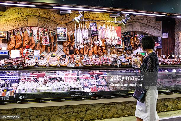 sausages and ham for sale, la boqueria market, barcelona - spanish food stock pictures, royalty-free photos & images