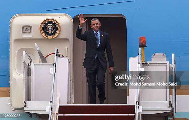 President Barack Obama arrive at the Royal Malaysian Air Force base ahead of the 27th Association of South-East Asian Nations Summit on November 20,...