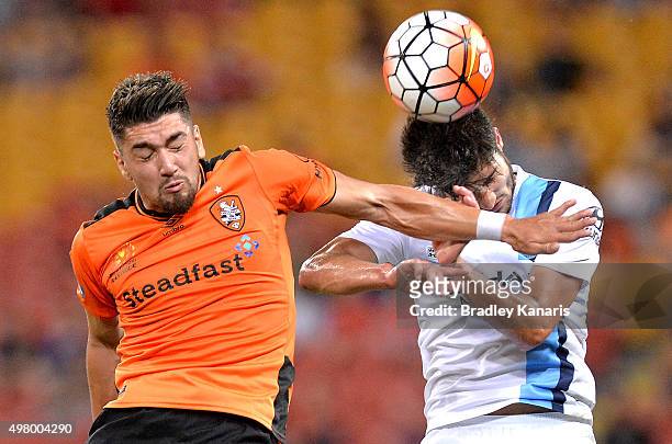 Dimitri Petratos of the Roar and Paulo Retre of Melbourne City challenge for the ball during the round seven A-League match between the Brisbane Roar...