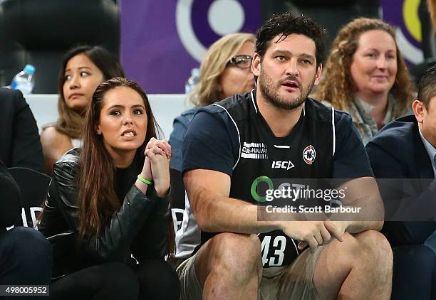 Brendan Fevola and Mia Fevola watch from the crowd during the round seven NBL match between Melbourne United and the Townsville Crocodiles at Hisense...
