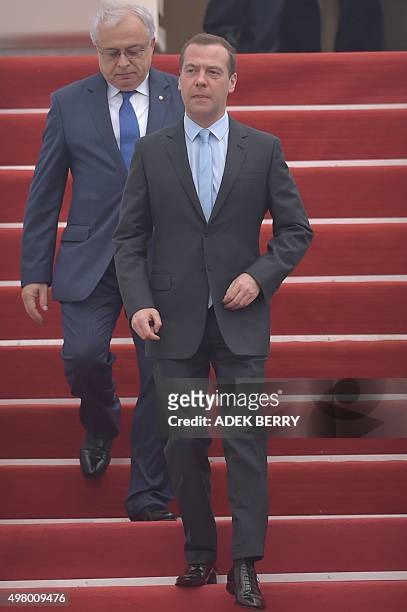 Russia's Prime Minister Dmitry Medvedev disembarks from his aircraft as he arrives to attend the 27th Association of Southeast Asian Nations Summit,...