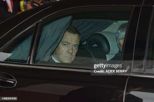 Russia's Prime Minister Dmitry Medvedev departs in a motorcade following his arrival to attend the 27th Association of Southeast Asian Nations...
