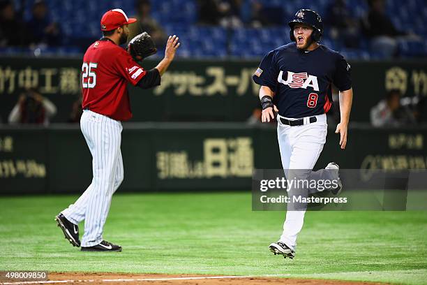 Infielder Tyler Pastornicky of the United States runs to score a run to make 3-1 in the bottom of fourth inning during the WBSC Premier 12 semi final...