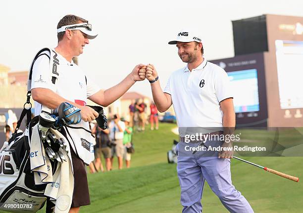 Andy Sullivan of England celebrates with his caddie Sean Mcdonagh after his birdie on the 18th hole during the second round of the DP World Tour...