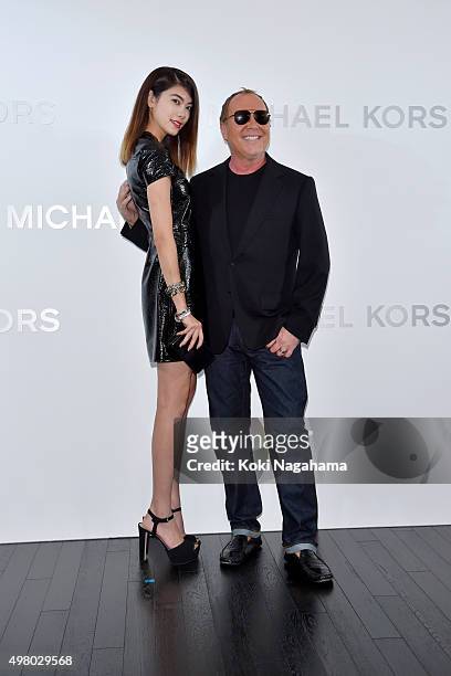 Michael Kors and model Hikari Mori attend the opening event for the Michael Kors Ginza Flagship Store on November 20, 2015 in Tokyo, Japan.