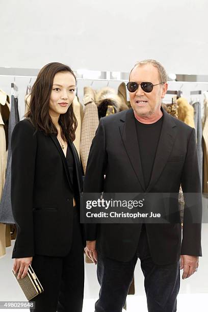 Designer Michael Kors and actress/model Rila Fukushima attend the opening event for the Michael Kors Ginza Flagship Store on November 20, 2015 in...