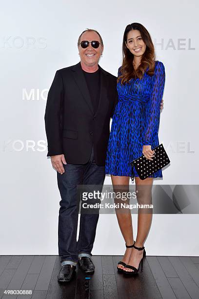 Designer Michael Kors and actress/model Izumi Mori attend the opening event for the Michael Kors Ginza Flagship Store on November 20, 2015 in Tokyo,...