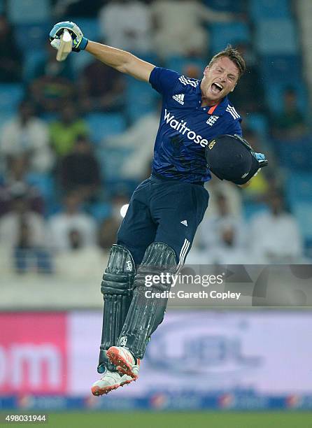 Jos Buttler of England celebrates reaching his century during the 4th One Day International between Pakistan and England at Dubai Cricket Stadium on...