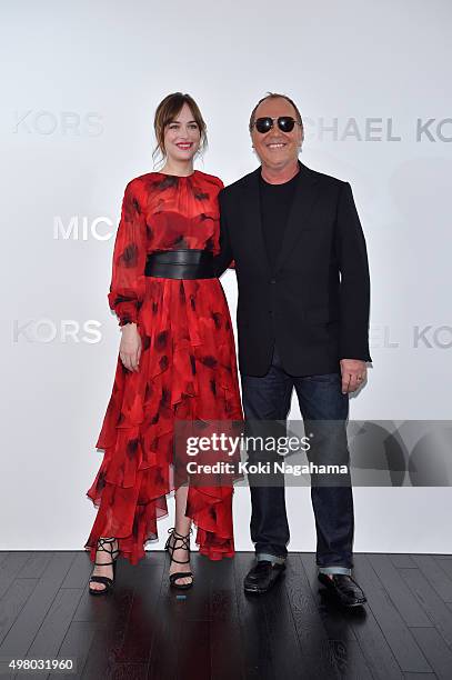 Designer Michael Kors and Dakota Johnson attend the opening event for the Michael Kors Ginza Flagship Store on November 20, 2015 in Tokyo, Japan.