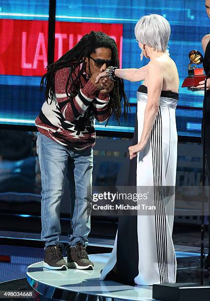 Tego Calderon accepts the Best Urban Music Album Grammy from Rita Moreno onstage during the 16th Annual Latin GRAMMY Awards held at MGM Grand Garden...