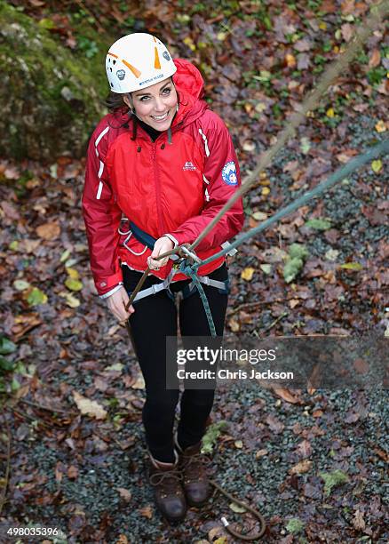 Catherine, Duchess of Cambridge abseils as she visits the Towers Residential Outdoor Education Centre on November 20, 2015 in Capel Curig, United...