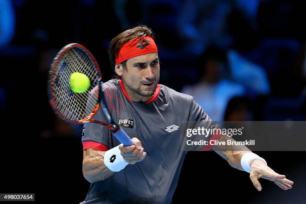 David Ferrer of Spain hits a forehand during the men's singles match against Rafael Nadal of Spain on day six of the Barclays ATP World Tour Finals...