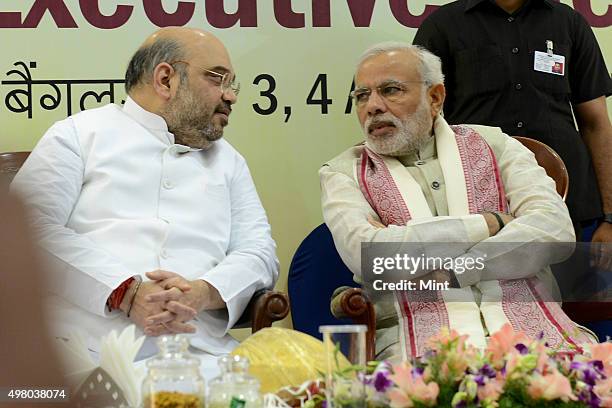 President Amit Shah and PM Narendra Modi during the BJP two-day National Executive meeting at Hotel Ashok, on April 3, 2015 in Bengaluru, India.