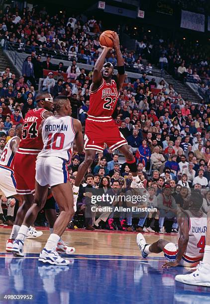 Michael Jordan of the Chicago Bulls shoots against the Detroit Pistons circa 1990 at the Palace of Auburn Hills in Auburn Hills, Michigan. NOTE TO...