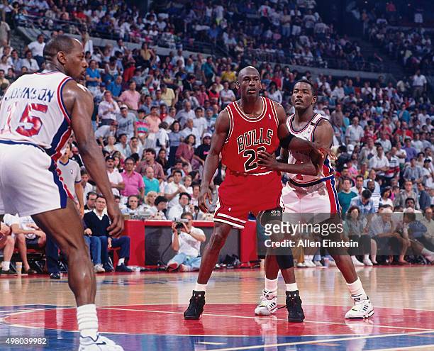 Michael Jordan of the Chicago Bulls battles for position against Joe Dumars of the Detroit Pistons circa 1990 at the Palace of Auburn Hills in Auburn...