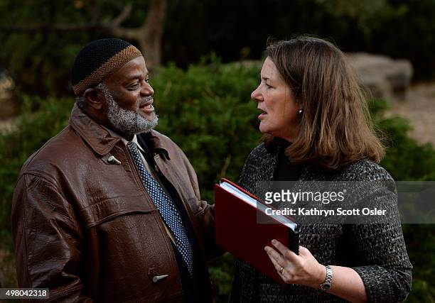 Rep. Diana DeGette, right, greets Imam Abdur-Rahim Ali, leader of the Northeast Denver Islamic Center, who has joined a small crowd gathered for a...