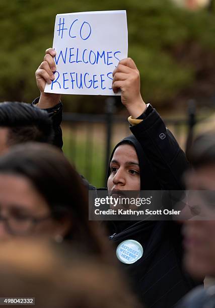 Nadeen Ibrahim of Denver joins a small crowd gathered for a press event at Sakura Square in downtown Denver for U.S. Rep. Diana DeGette as she speaks...