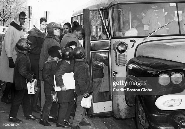 Students with Operation Exodus board a bus at Blue Hill Avenue and Columbia Road in Roxbury headed to E.P. Tileston Elementary School in Mattapan on...