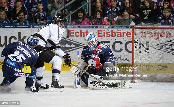 David Steckel of the Thomas Sabo Ice Tigers Nuernberg scores the 1:1 against Petri Vehanen of the Eisbaeren Berlin during the game between the...