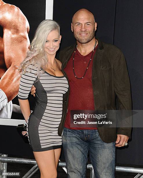 Mindy Robinson and Randy Couture attend the premiere of "Creed" at Regency Village Theatre on November 19, 2015 in Westwood, California.