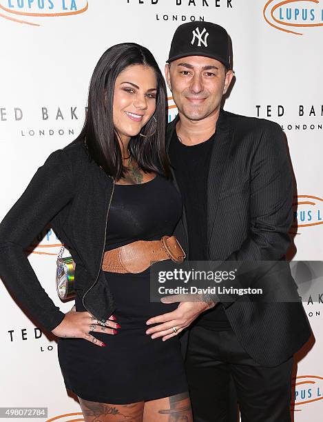 Musical artist Dennis DeSantis and wife attend the 13th Annual Lupus LA Hollywood Bag Ladies Luncheon at The Beverly Hilton Hotel on November 20,...
