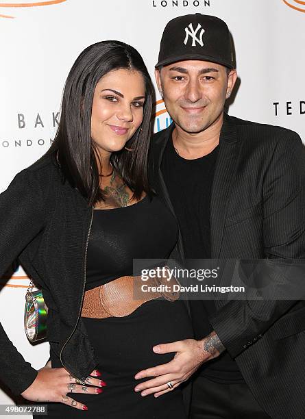 Musical artist Dennis DeSantis and wife attend the 13th Annual Lupus LA Hollywood Bag Ladies Luncheon at The Beverly Hilton Hotel on November 20,...