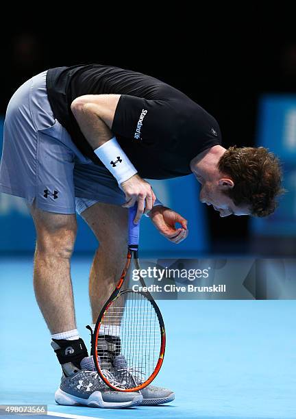 Dejected Andy Murray of Great Britain reacts during the men's singles match against Stan Wawrinka of Switzerland on day six of the Barclays ATP World...