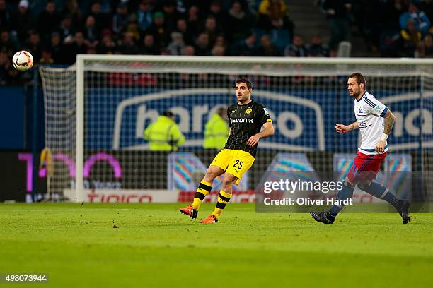 Pierre Michel Lasogga of Hamburg and Papastathopoulos Sokratis of Dortmund compete for the ball during the First Bundesliga match between Hamburger...