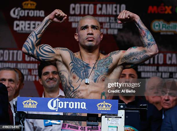 Miguel Cotto poses on the scale during his official weigh-in at the Mandalay Bay Events Center on November 20, 2015 in Las Vegas, Nevada. Cotto will...