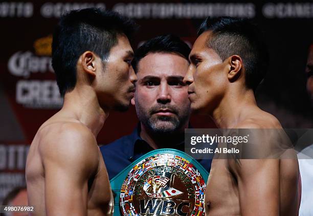 Super featherweight champion Takashi Miura and Francisco Vargas face off during their official weigh-in at the Mandalay Bay Events Center on November...