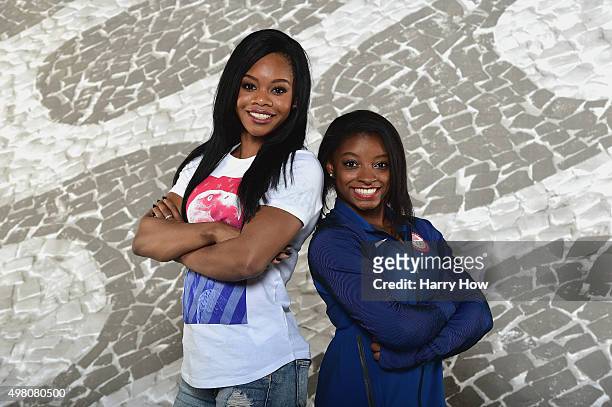 Gymnasts Gabby Douglas and Simone Biles pose for a portrait at the USOC Rio Olympics Shoot at Quixote Studios on November 20, 2015 in Los Angeles,...
