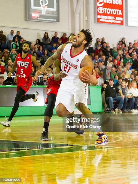 James Young of the Maine Red Claws is fouled by the Toronto Raptors 905 in their home opener on November 20, 2015 at the Portland Expo in Portland,...