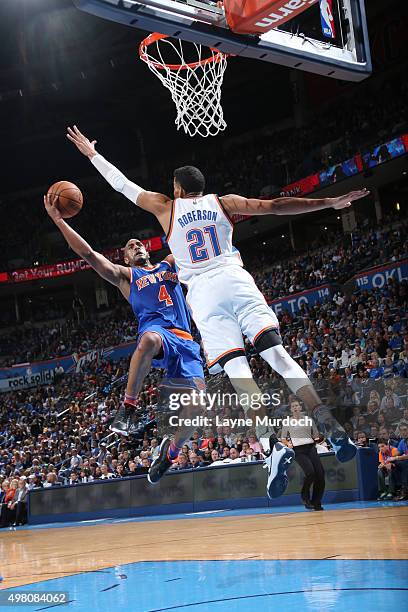 Arron Afflalo of the New York Knicks goes for the layup against Andre Roberson of the Oklahoma City Thunderduring the game on November 20, 2015 at...