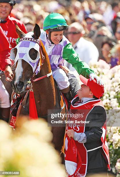 Michelle Payne is congratulated by her brother Steven Payne, who has Down syndrome and works as a strapper after Michelle Payne riding Prince Of...