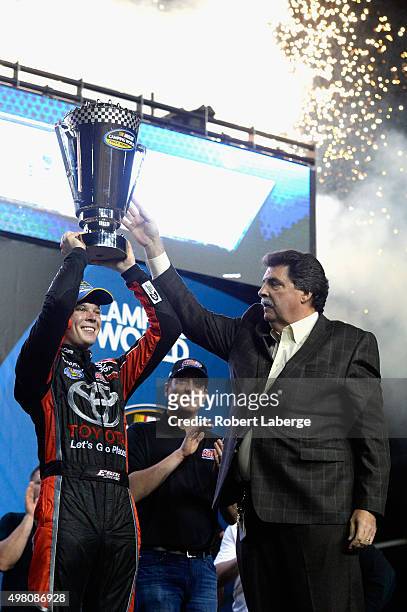 Erik Jones, driver of the Toyota, celebrates in victory lane after winning the series championship during the NASCAR Camping World Truck Series Ford...