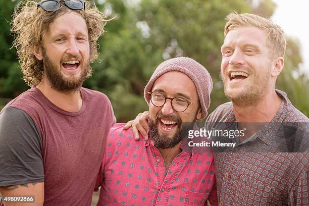 best friends laughing and joking around at outdoor party - australian bbq stock pictures, royalty-free photos & images