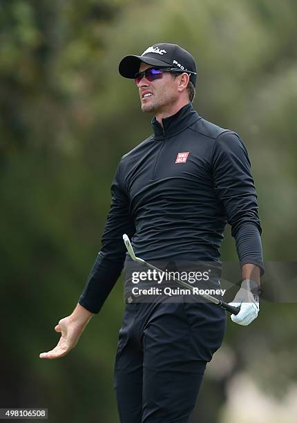 Adam Scott of Australia reacts after miss hitting an approach shot during day three of the 2015 Australian Masters at Huntingdale Golf Club on...