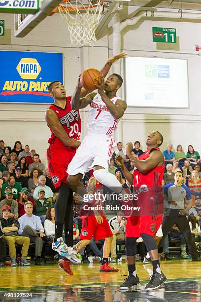 Terry Rozier of the Maine Red Claws tries to avoid a block by Bruna Caboclo of the Toronto Raptors 905 on November 20, 2015 at the Portland Expo in...