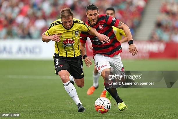 Benjamin Sigmund of the Phoenix and Frederico Piovaccari of the Wanderers contest the ball during the round seven A-League match between Western...