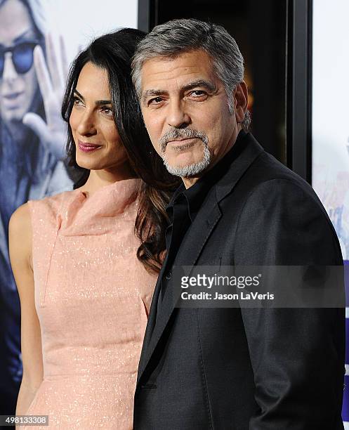 Amal Clooney and George Clooney attend the premiere of "Our Brand Is Crisis" at TCL Chinese Theatre on October 26, 2015 in Hollywood, California.