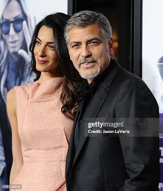 Amal Clooney and George Clooney attend the premiere of "Our Brand Is Crisis" at TCL Chinese Theatre on October 26, 2015 in Hollywood, California.