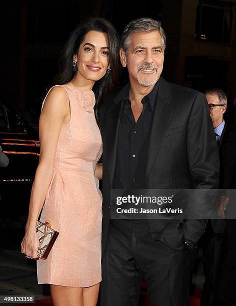 Amal Clooney and George Clooney attend the premiere of "Our Brand Is Crisis" at TCL Chinese Theatre on October 26, 2015 in Hollywood, California.