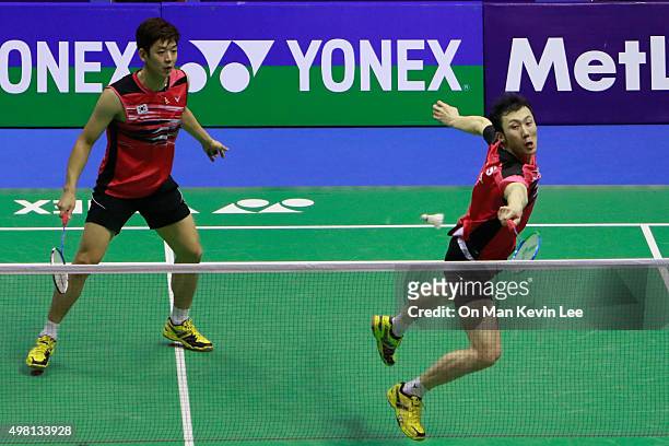 Yoo Yeon Seong and Lee Yong Dae of South Korea return a shot during the match between Lee Yong Dae and Yoo Yeon Seong of South Korea and Chai Biao...