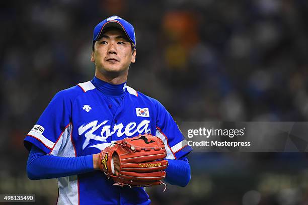 Kwanghyun Kim pitches in the bottom half of the first inning during the WBSC Premier 12 final match between South Korea and the United States at the...