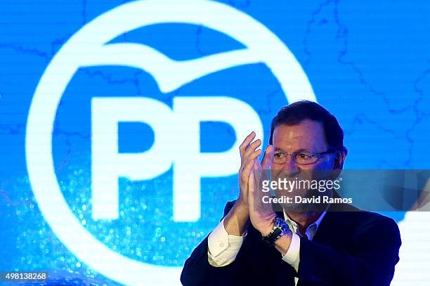 Spain's Prime Minister and President of Partido Popular waves during the official presentation of the Partido Popular candidates on November 21, 2015...