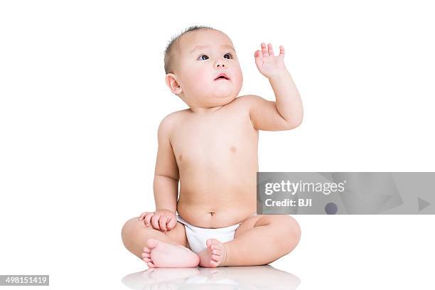 cute baby boy with ball - sitting on ground stock pictures, royalty-free photos & images