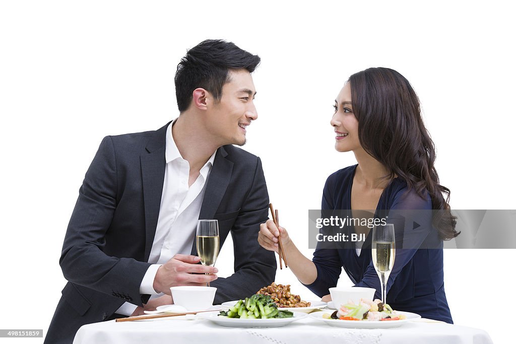 Happy young couple having dinner