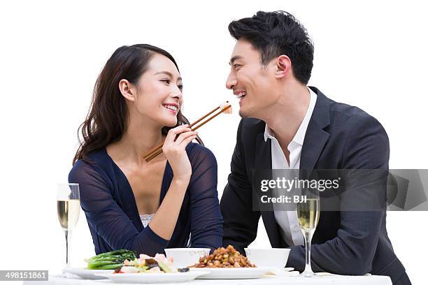 happy young couple having dinner - well dressed couple isolated stock pictures, royalty-free photos & images