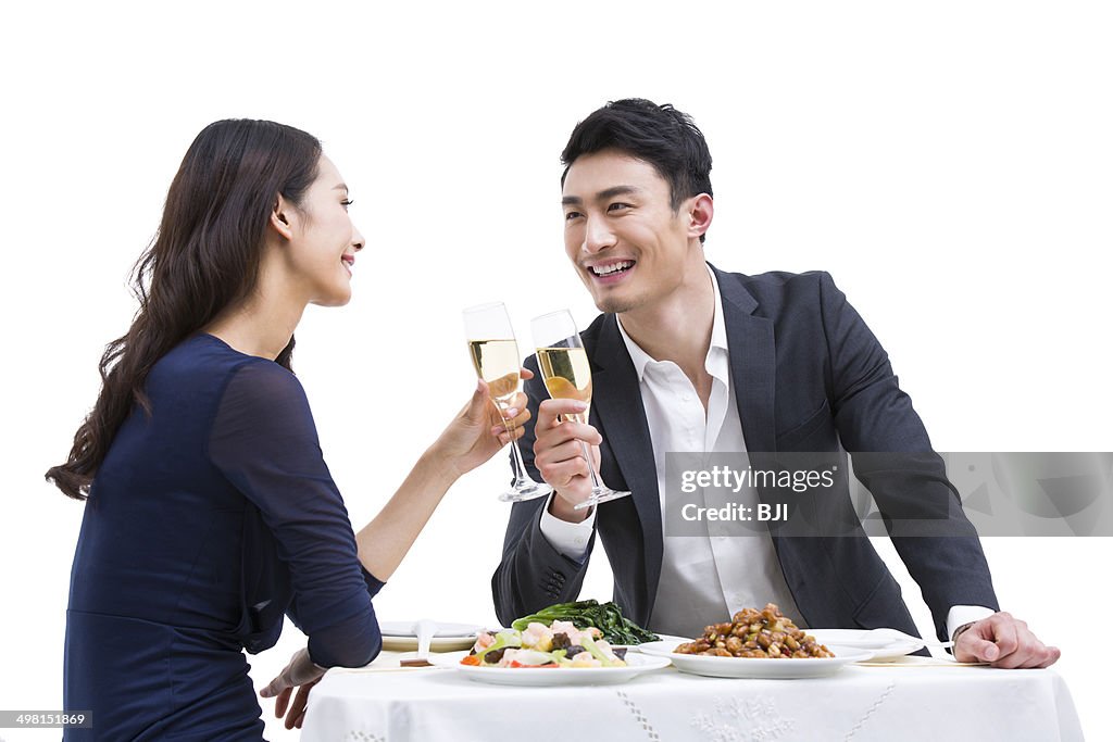Happy young couple having dinner