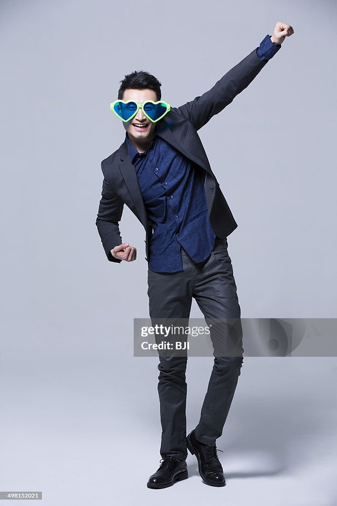 Hip young man wearing big sunglasses